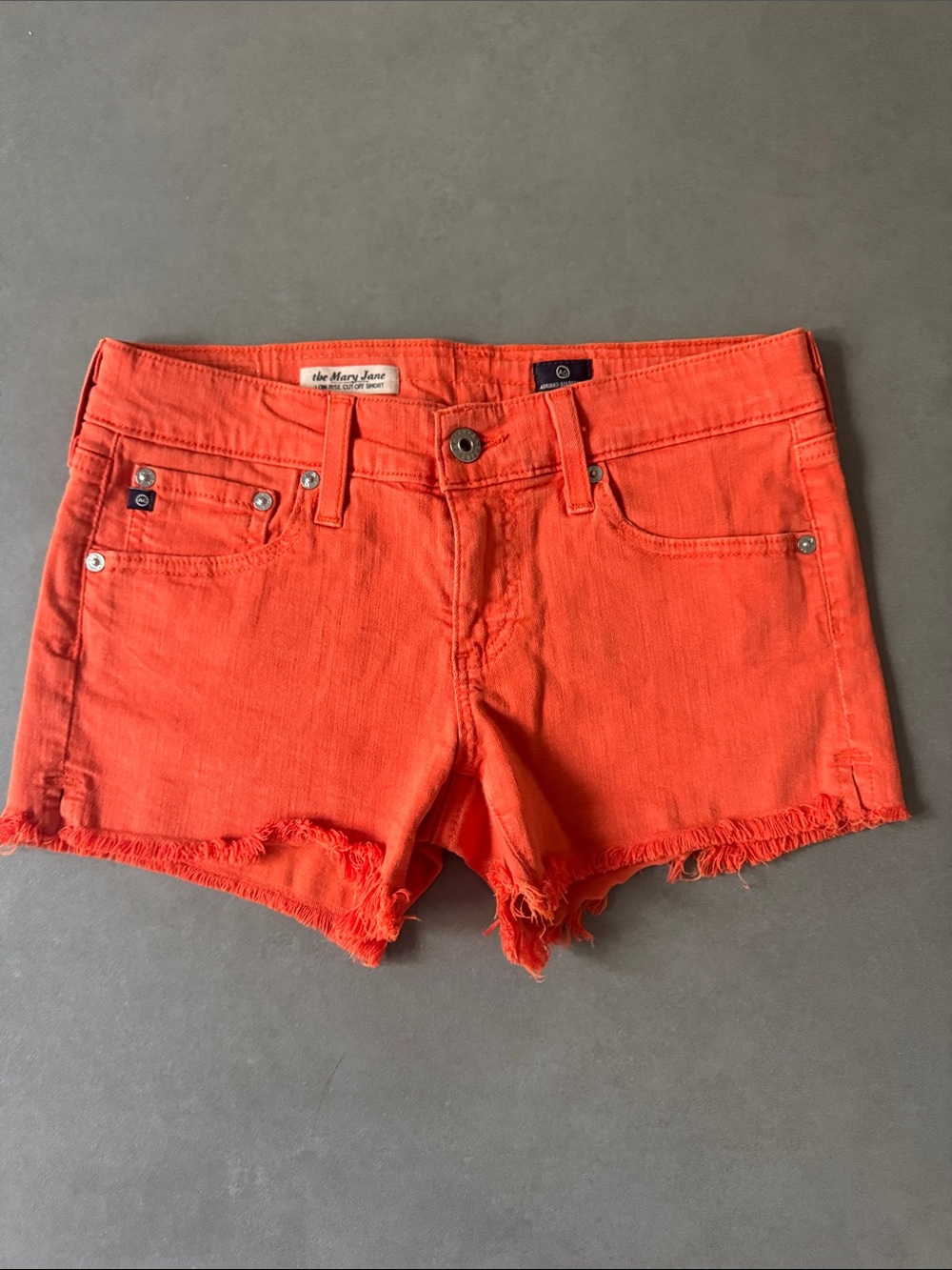 AG Orange Denim low rise Cutoff Shorts size 26